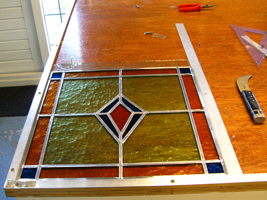 Het raam in het lood gezet