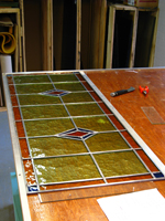 Groot glas-in-lood voorzetraam